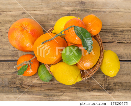 Citrus fruits on wooden background Citrus fruits on wooden background 17820475