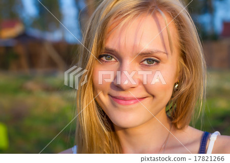Beautiful young blond woman outdoors 17821266