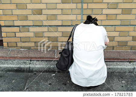 A woman crawling on the street A woman crawling on the street 17821783
