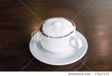 Hot Cappuccino on wood table Hot Cappuccino on wood table 17823172