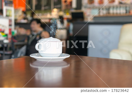 Coffee cup on coffee shop blur background Coffee cup on coffee shop blur background 17823642