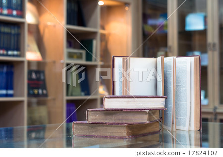 old book on the glass desk in library 17824102