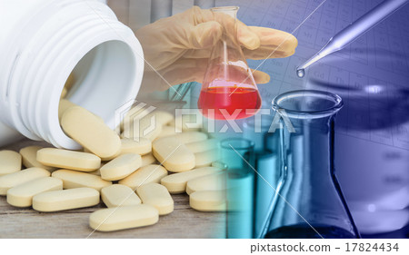 Test flask with Pills or vitamin in Medicine bottles on wood bac 17824434