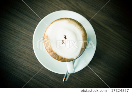 Hot Cappuccino Coffee cup on the wood table, top view Hot Cappuccino Coffee cup on the wood table, top view 17824827