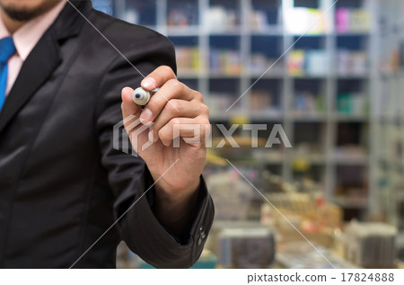 Businessman writing the board on Abstract blurred photo of book Businessman writing the board on Abstract blurred photo of book 17824888