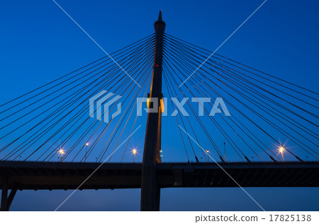 silhouette of Fragment of a cable stayed bridge at twilight time silhouette of Fragment of a cable stayed bridge at twilight time 17825138