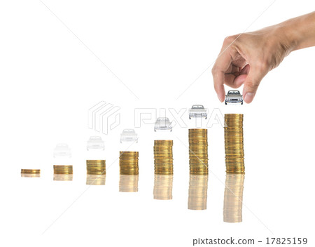 Hand holding a car on the stacks of gold coins on white backgrou 17825159