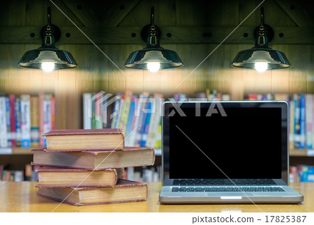 old book on the desk in library with laptop and Luxury lighting old book on the desk in library with laptop and Luxury lighting 17825387