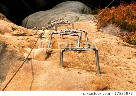 Climbers metal ladder via ferrata. Iron rope 17825978