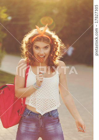 Pin Up Girl biting a lollipop. Pin Up Girl biting a lollipop. 17827305