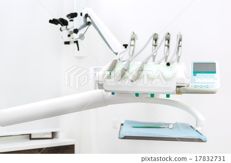 Dental instruments and microscope on background 17832731