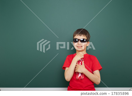 boy with water bottle and school board boy with water bottle and school board 17835896