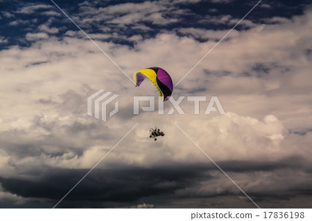 Powered parachute in the sky. 17836198
