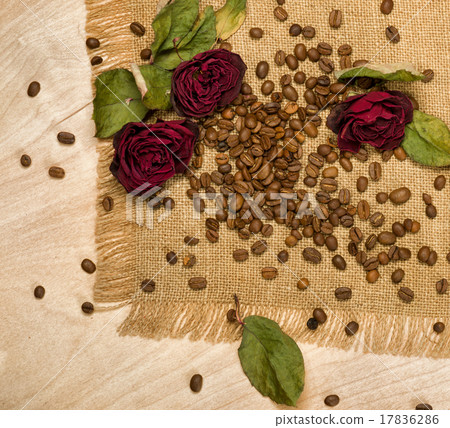 dry red roses on coffee seeds 17836286