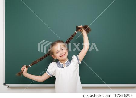 Schoolgirl near school board Schoolgirl near school board 17836292