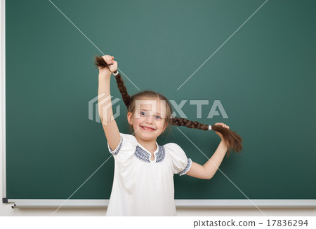 Schoolgirl near school board 17836294