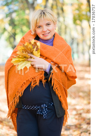 pregnant woman in autumn park pregnant woman in autumn park 17836757