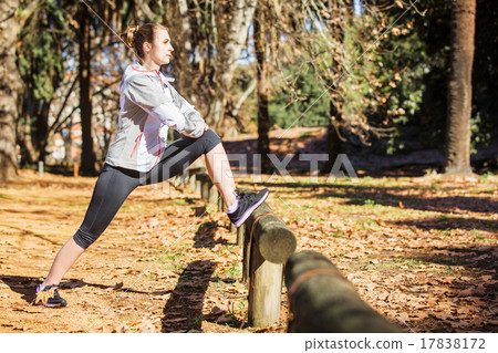 Young fit girl stretching out on bench before Young fit girl stretching out on bench before 17838172