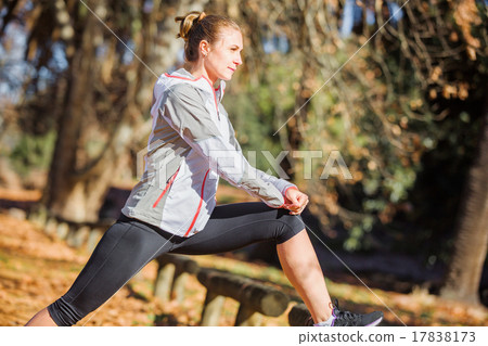 Young fit girl stretching out on bench before Young fit girl stretching out on bench before 17838173