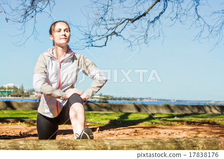 Young fit girl stretching out on bench before Young fit girl stretching out on bench before 17838176