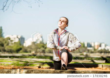 Young fit girl stretching out on bench before Young fit girl stretching out on bench before 17838246