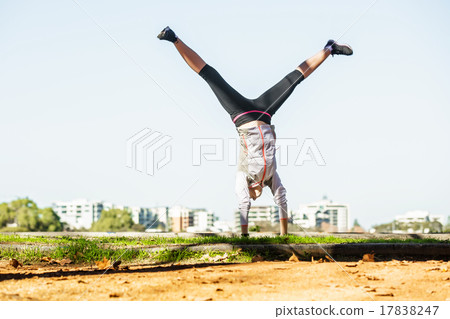 Young fit woman doing simple acrobatics exercise Young fit woman doing simple acrobatics exercise 17838247