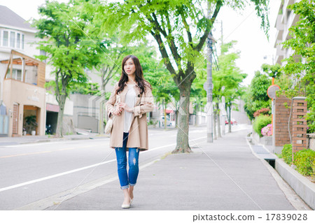 A woman walking in the city 17839028