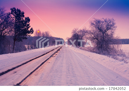 Sunrise over snowy road Sunrise over snowy road 17842052