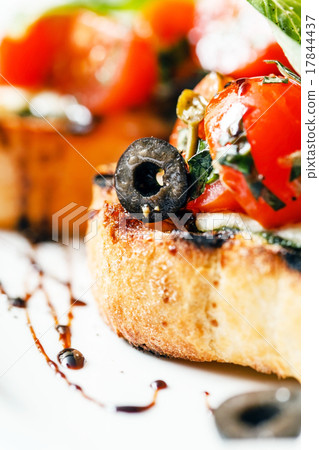Bruschetta with tomato, mozarella and basil Bruschetta with tomato, mozarella and basil 17844437