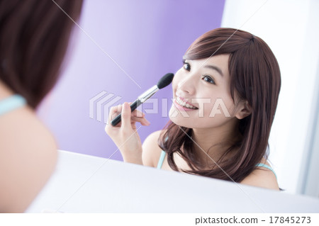 Smile woman with makeup brushes 17845273