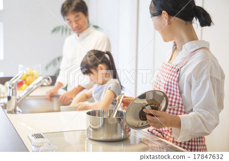 A family cooking in a bright kitchen 17847632