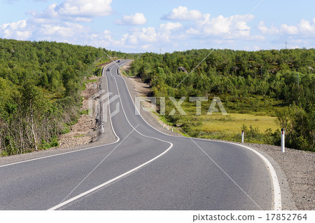 Asphalt road among the green hills 17852764