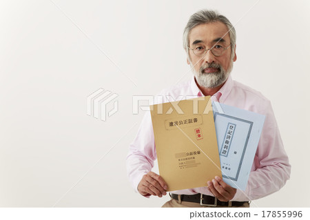 Male senior with a serious look at the testamentary notary and real estate registry 17855996