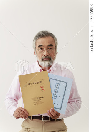 Male senior with a serious look at the testamentary notary and real estate registry Male senior with a serious look at the testamentary notary and real estate registry 17855998