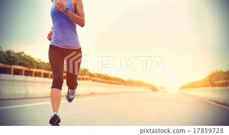young woman runner running on city bridge road 17859728