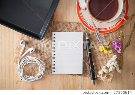Notepad on wood table 17860614