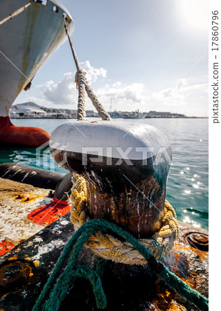Close-up of mooring bollard with rope Close-up of mooring bollard with rope 17860796