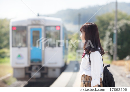 A pretty school girl who waits for a train at the station home 17862306