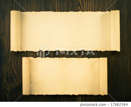 parchment scroll on wood 17862564