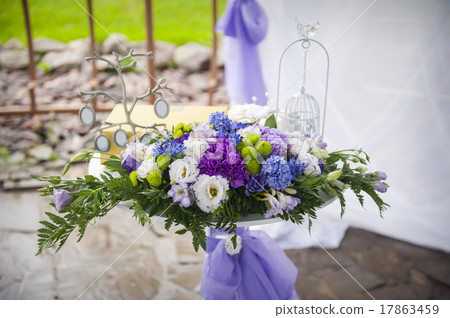 compositions of flowers at the wedding 17863459