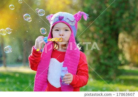 girl with soap bubbles in a knitted hat handmade girl with soap bubbles in a knitted hat handmade 17863607