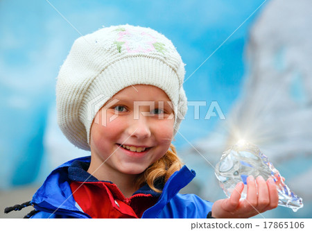 Girl with ice piece near Nigardsbreen glacier (Norway) Girl with ice piece near Nigardsbreen glacier (Norway) 17865106