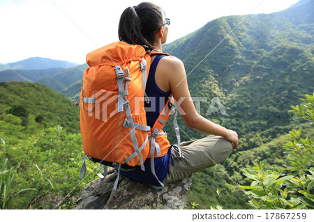 young woman hiker enjoy the view on mountain peak young woman hiker enjoy the view on mountain peak 17867259