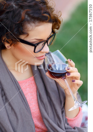 Pleasant girl drinking wine  17867550