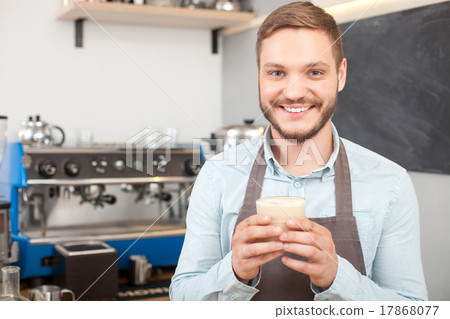 Attractive male owner of coffee shop is working 17868077