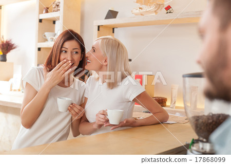 Attractive young girls are talking in cafeteria 17868099