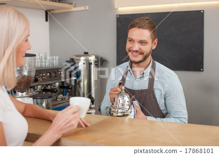 Cheerful male owner of cafeteria is serving Cheerful male owner of cafeteria is serving 17868101