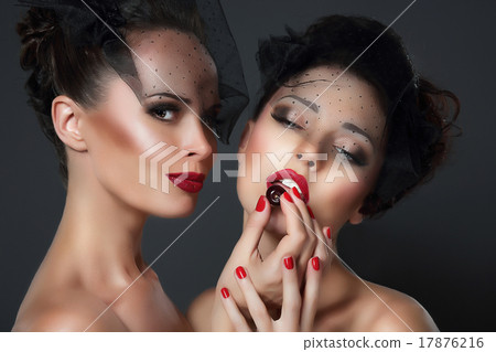 Lure. Two seductive Women with Cherry Berries 17876216