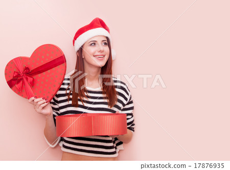 girl in Santa Claus hat with gift box 17876935