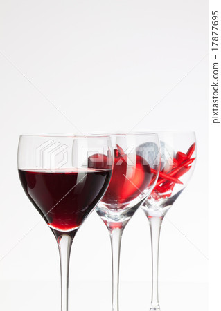 Wine glasses with red wine, heart and golf ball Wine glasses with red wine, heart and golf ball 17877695